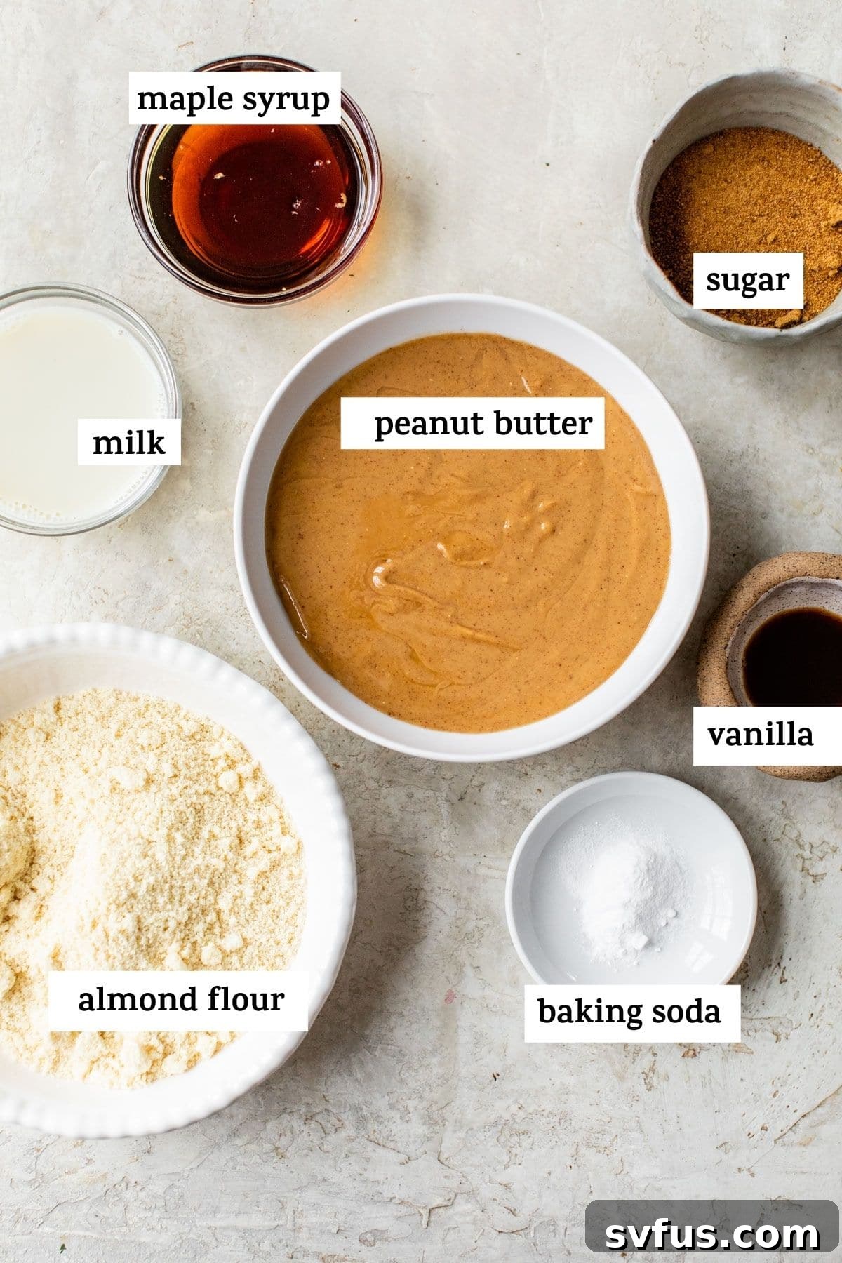 Bowls of raw ingredients for almond flour peanut butter cookies