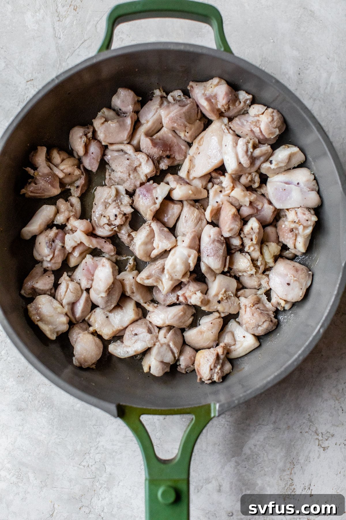 diced cooked chicken in a skillet