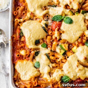 casserole dish filled with pasta, marinara sauce and cheese
