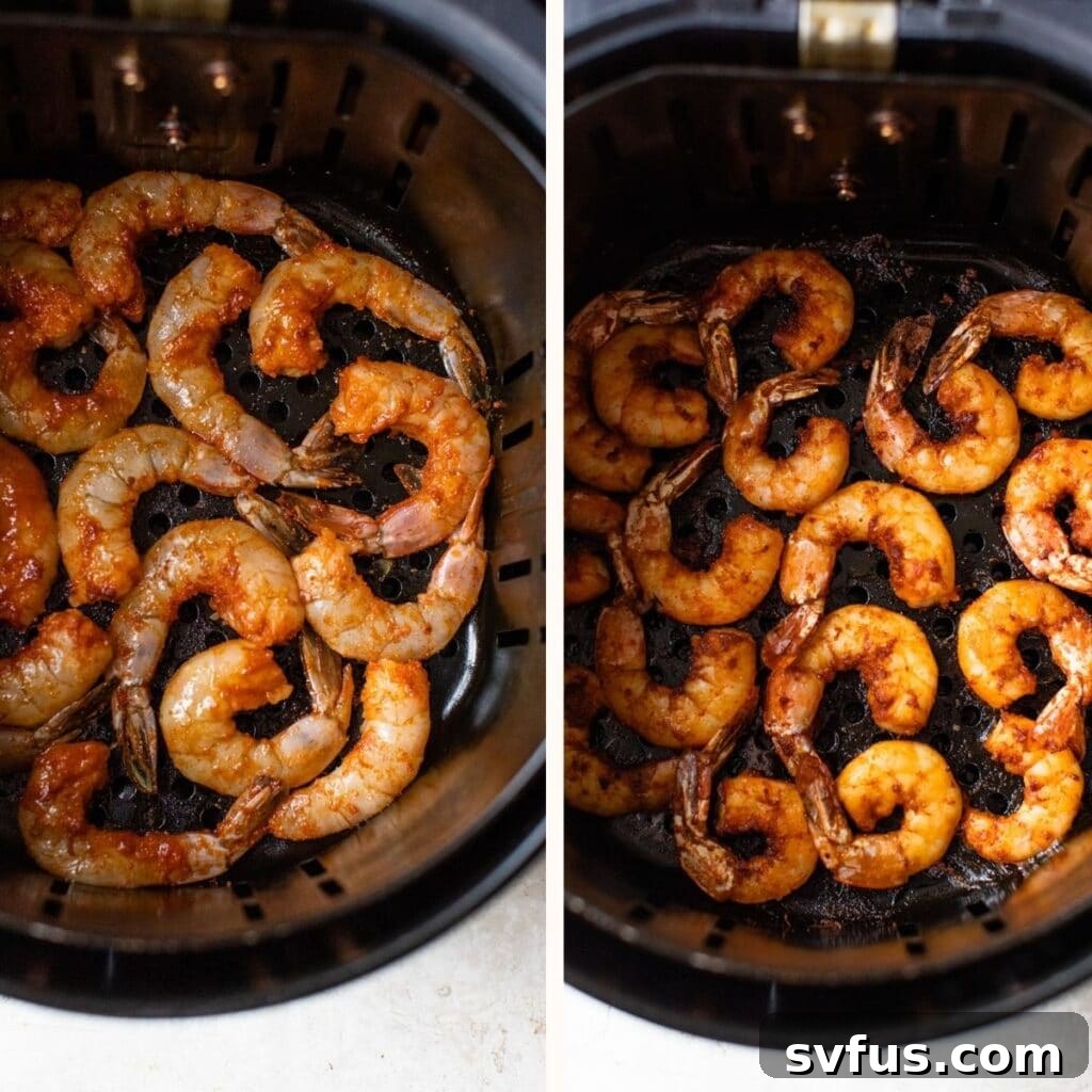 Seasoned shrimp arranged in a single layer inside an air fryer basket, ready for cooking.