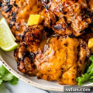 mango chicken thighs on a plate