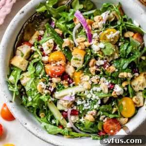 Fattoush salad in a bowl made with toasted bread, tomatoes and cucumber