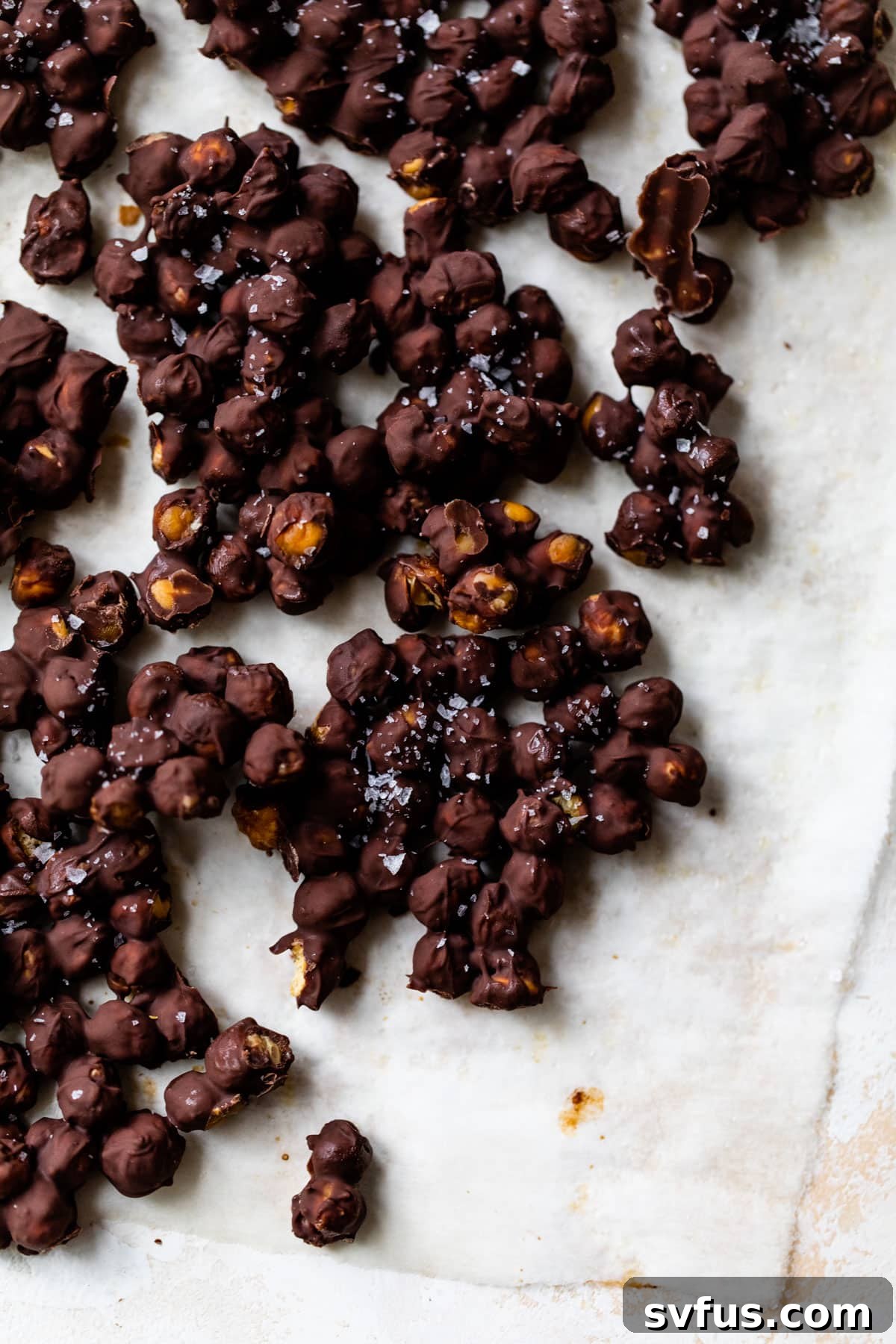 close-up of clumps of chocolate chickpeas in a bowl