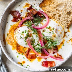 Greek yogurt topped with poached eggs, pickled red onion and bacon