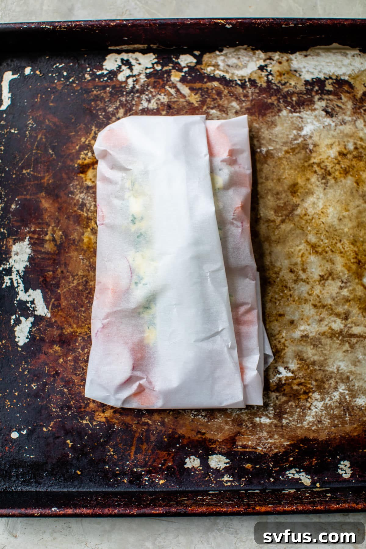 parchment pouch on a baking sheet