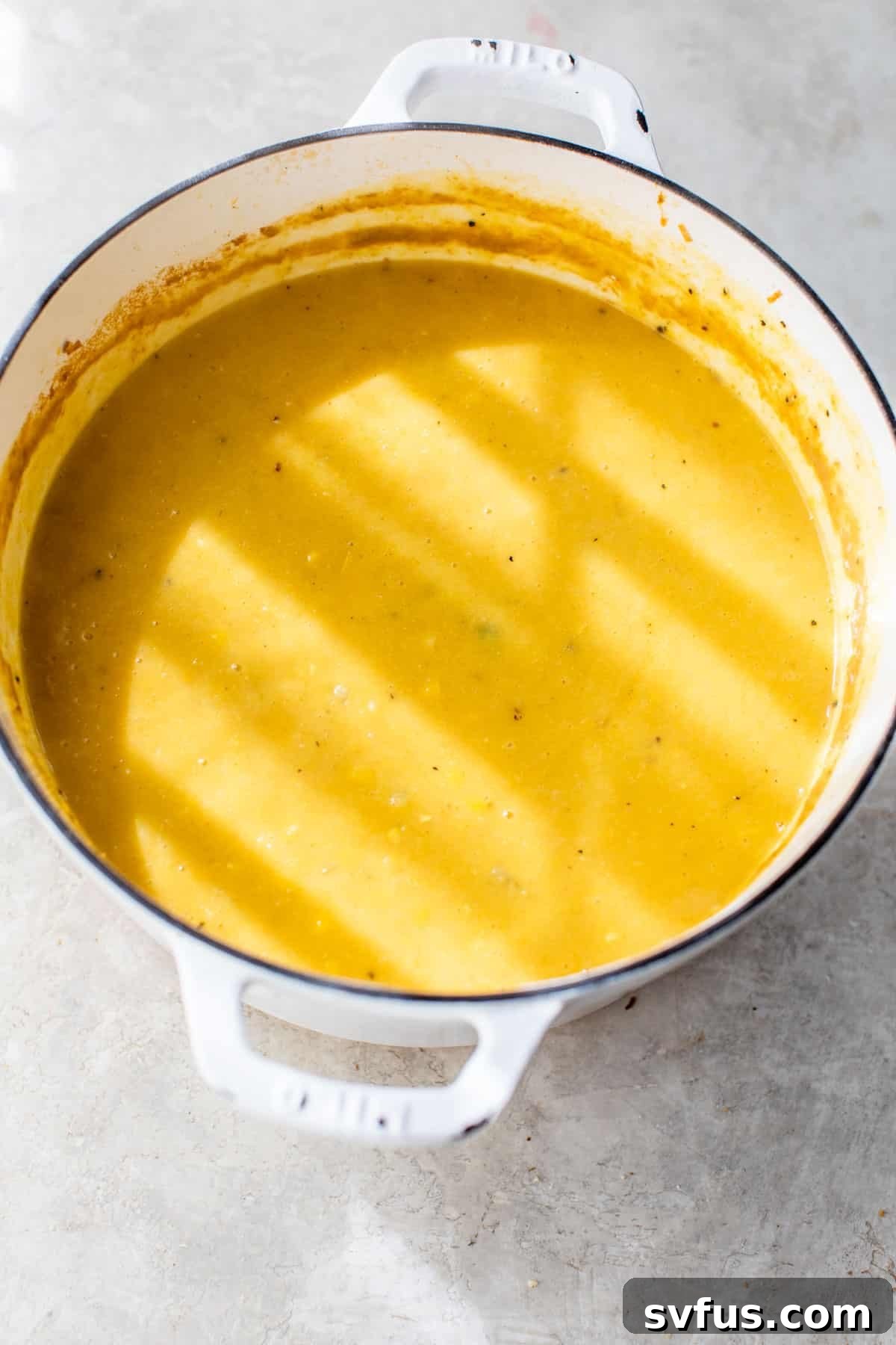 pot of creamy yellow-colored soup
