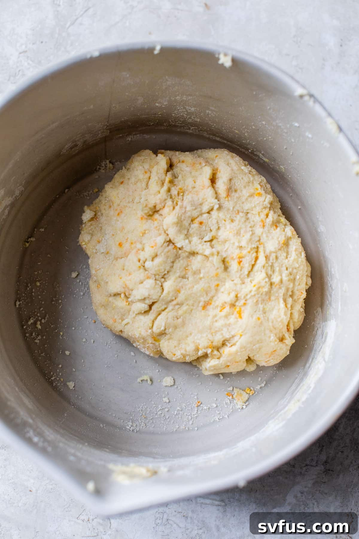 Scone batter in a large mixing bowl, ready to be formed into a disc.