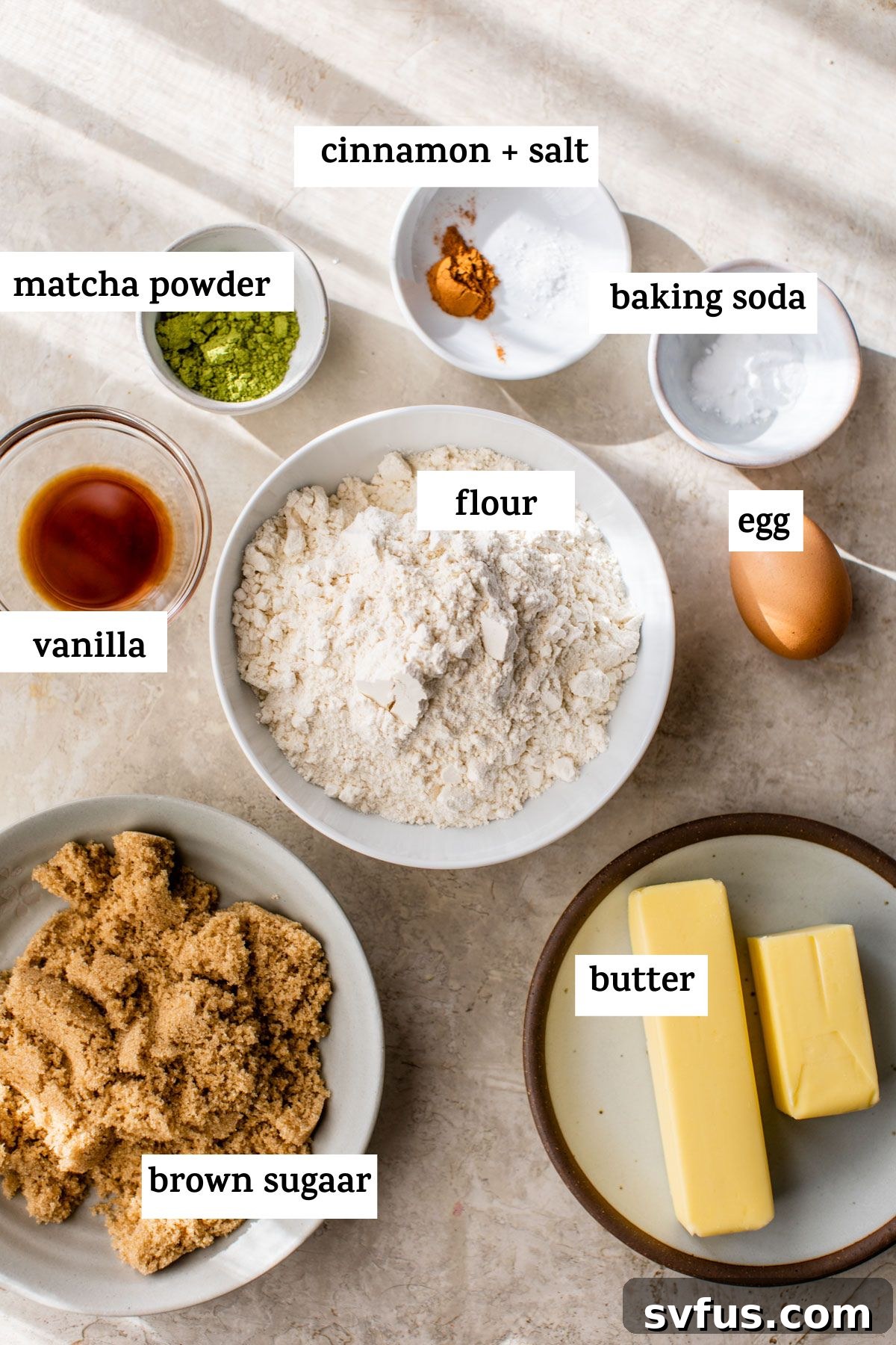 Ingredients for matcha snickerdoodles laid out on a surface, including butter, sugar, matcha powder, and flour, with text overlay.