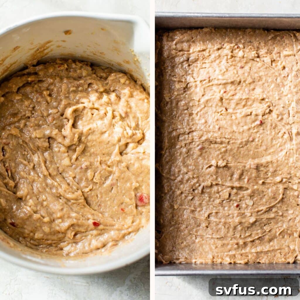 Close-up of fluffy vegan apple cake batter in a mixing bowl, next to a rectangular baking pan, ready for the oven.