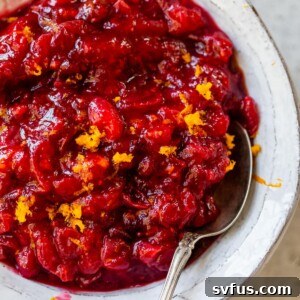 a bowl of cranberry sauce topped with orange zest