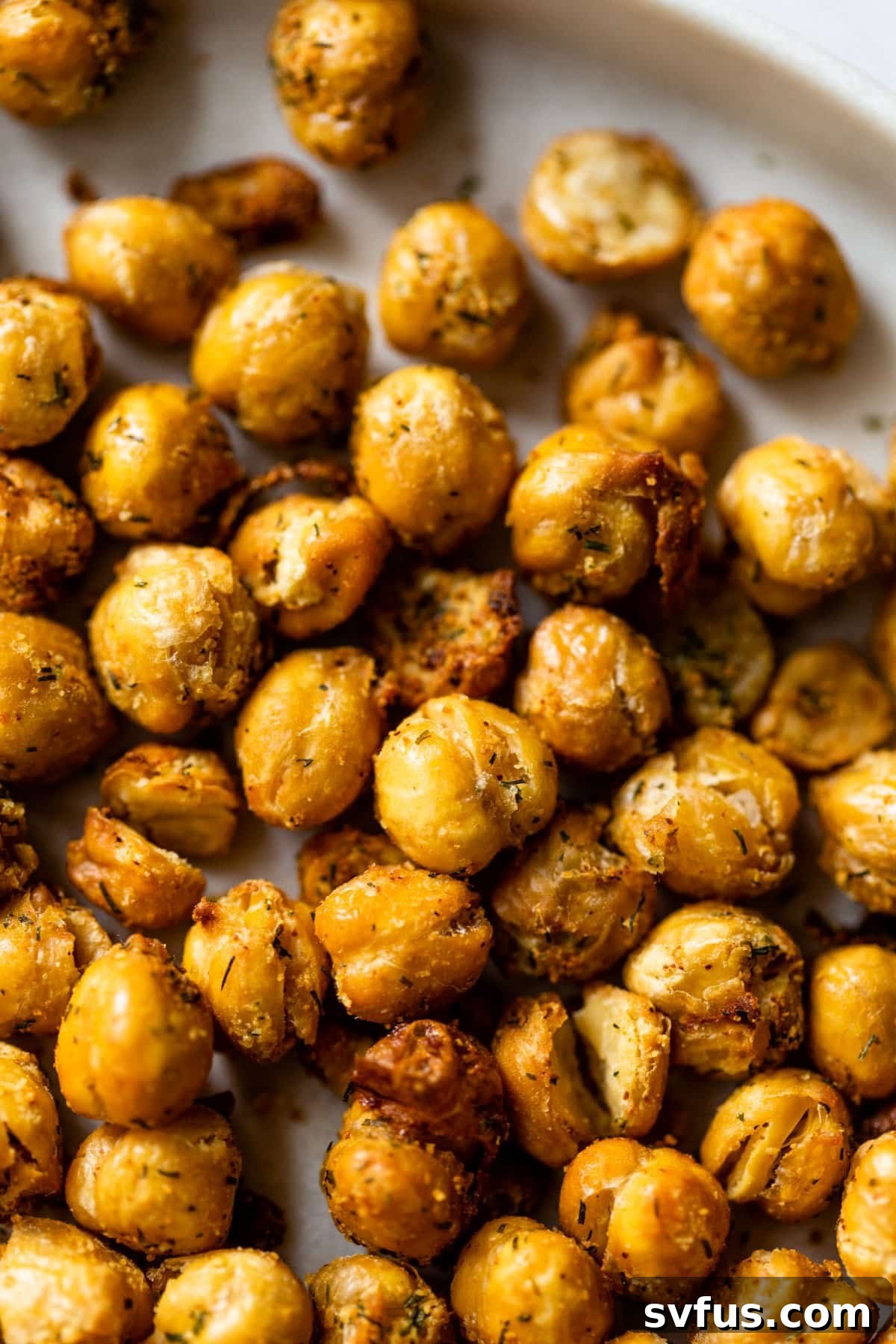 Close-up photo of crispy air fryer chickpeas, perfectly seasoned and ready to eat.