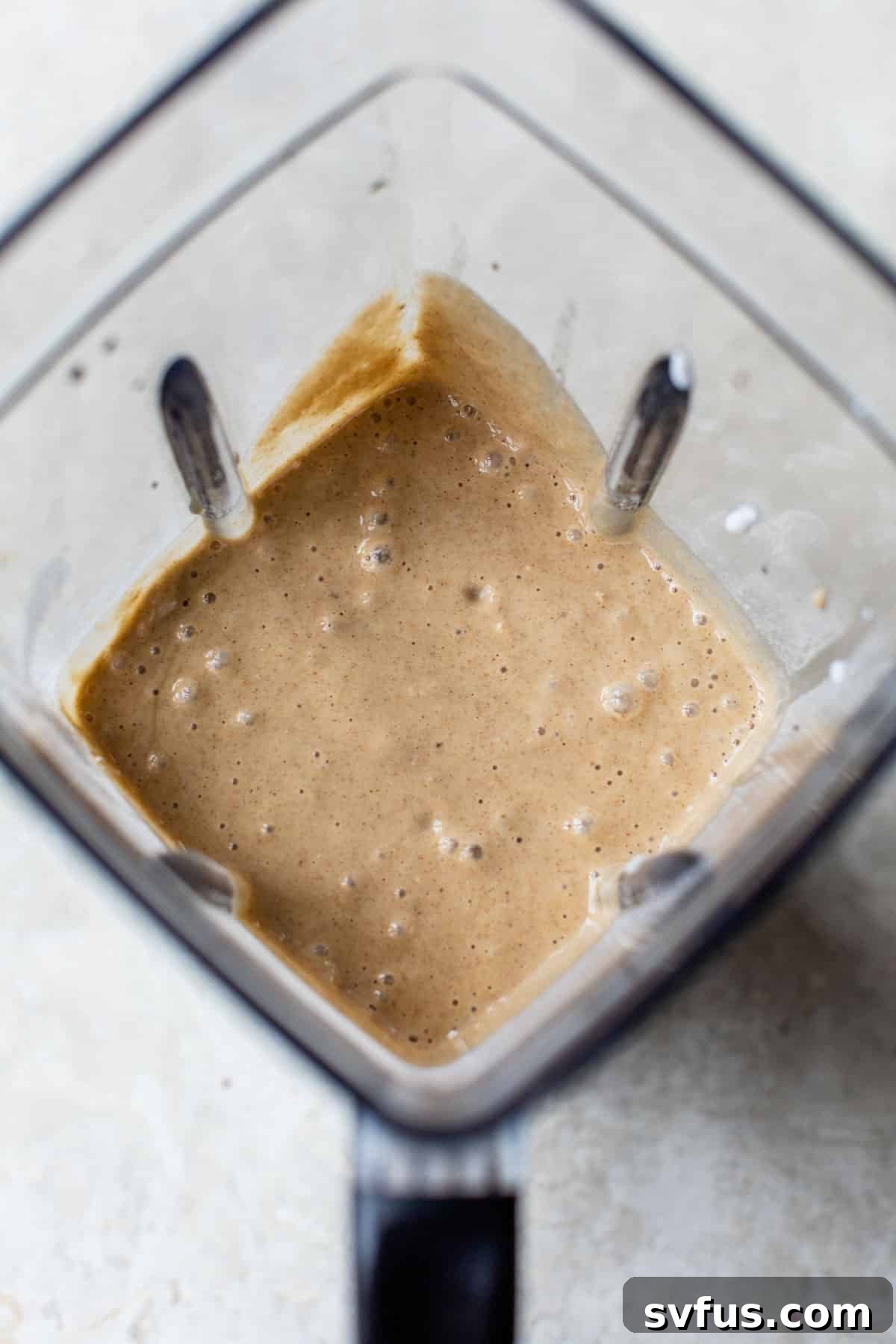 smooth, creamy pancake batter swirling inside a high-powered blender, ready for cooking