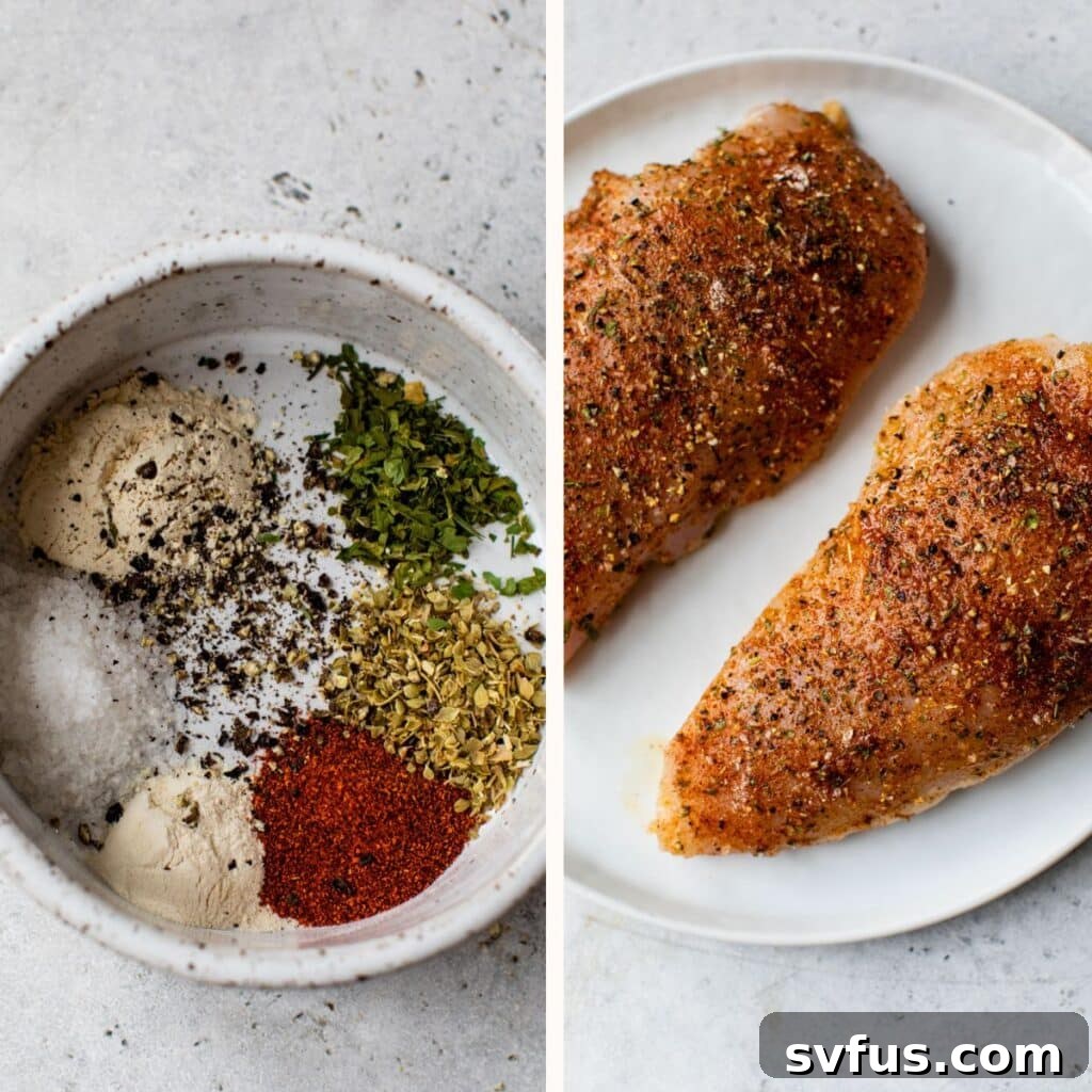 a small bowl of seasoning blend next to raw chicken breasts seasoned with oil and spices