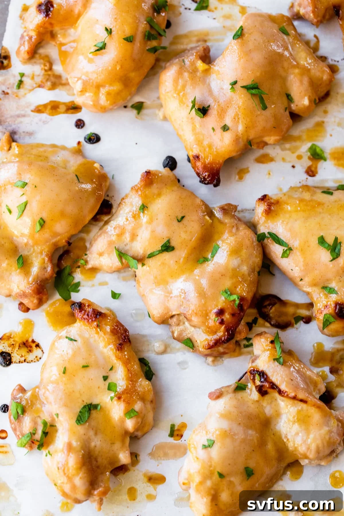marinated boneless chicken thighs on parchment paper