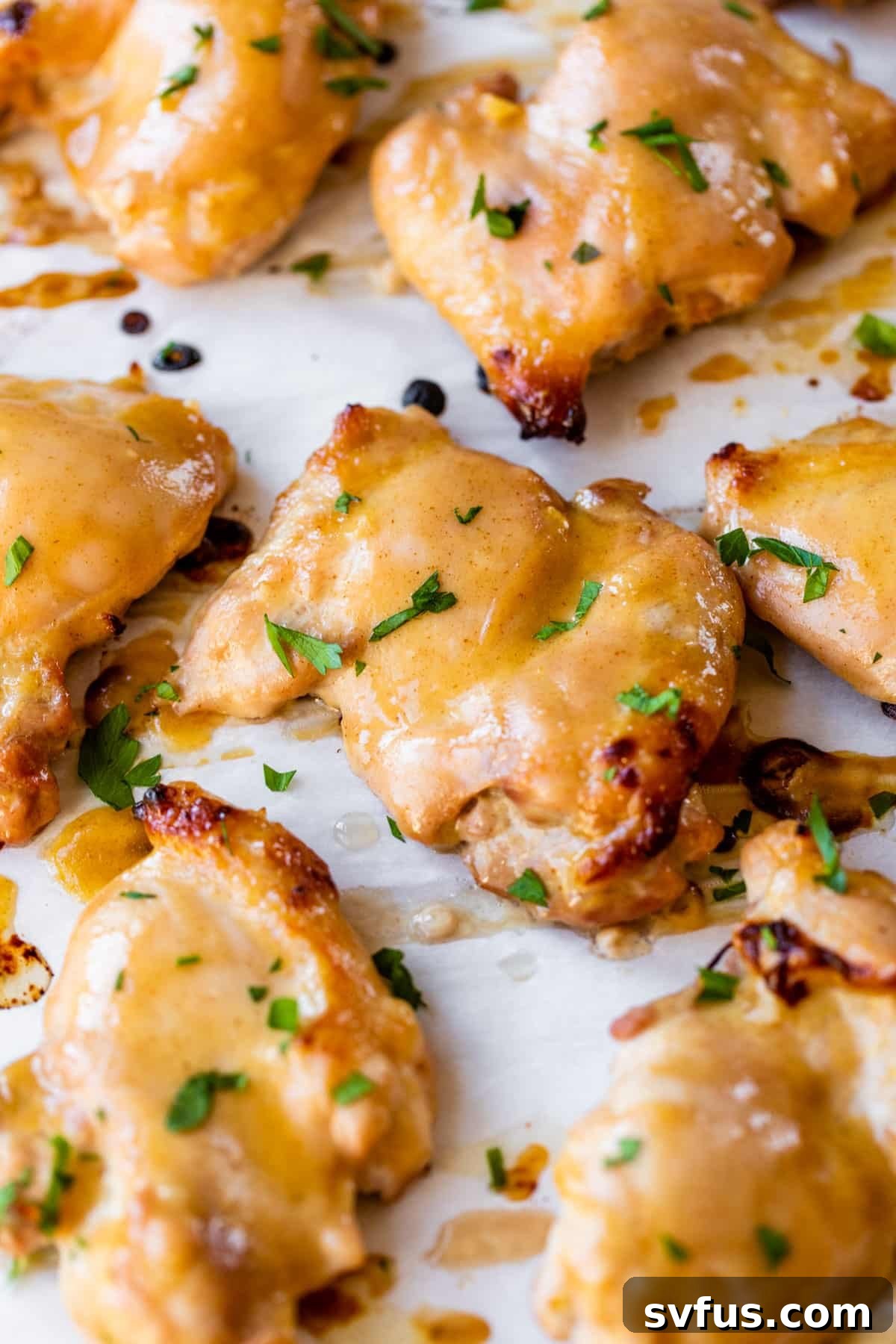 marinated chicken thighs on parchment paper