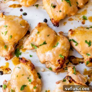 marinated boneless chicken thighs on parchment paper