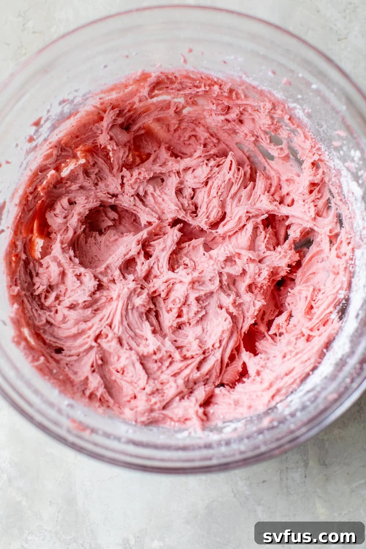 a bowl of strawberry icing