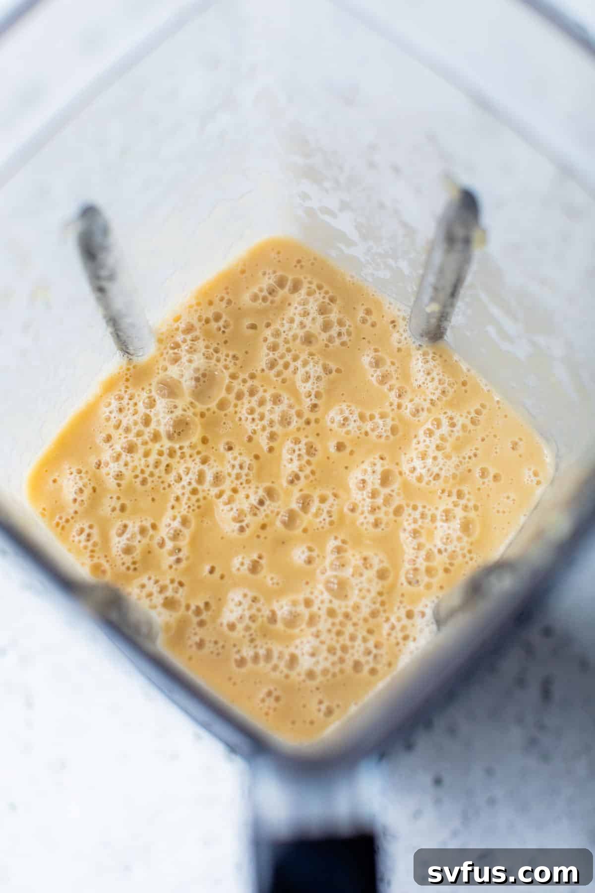 the cauliflower mixture being blended together for broccoli cheddar soup