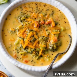 bowl of broccoli cheddar soup with a spoon