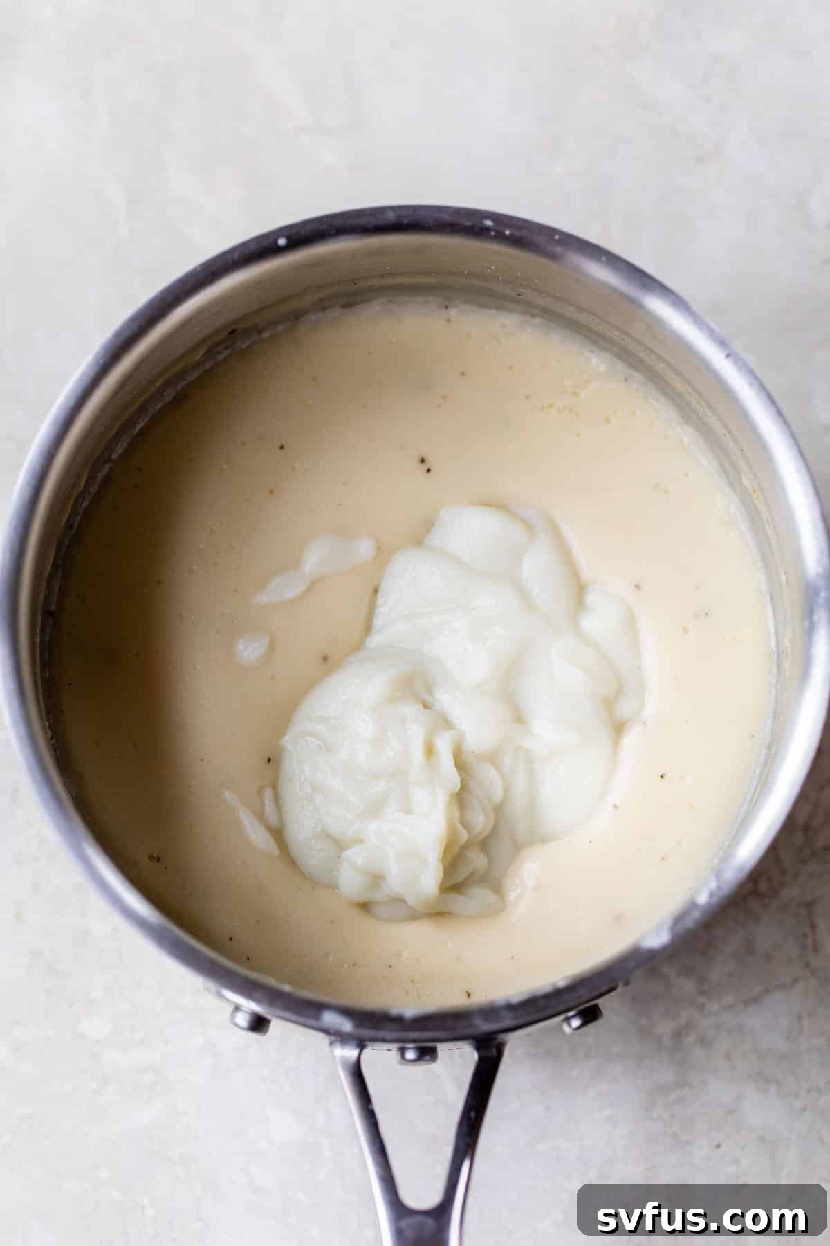 sauce pan filled with healthy alfredo sauce