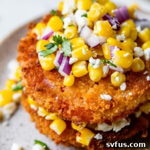 fried tomato slices topped with corn