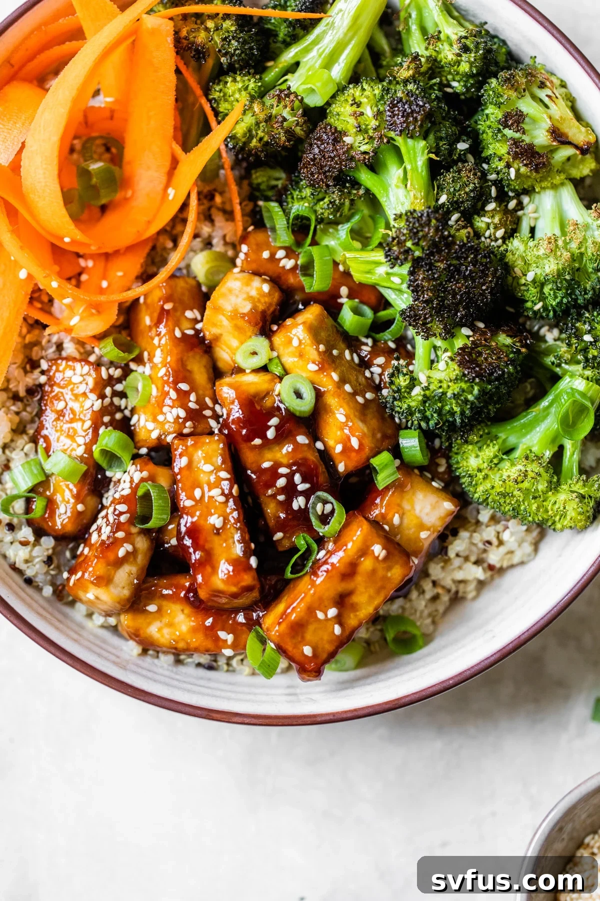 A plate of food with broccoli, with Tofu and Bowl
