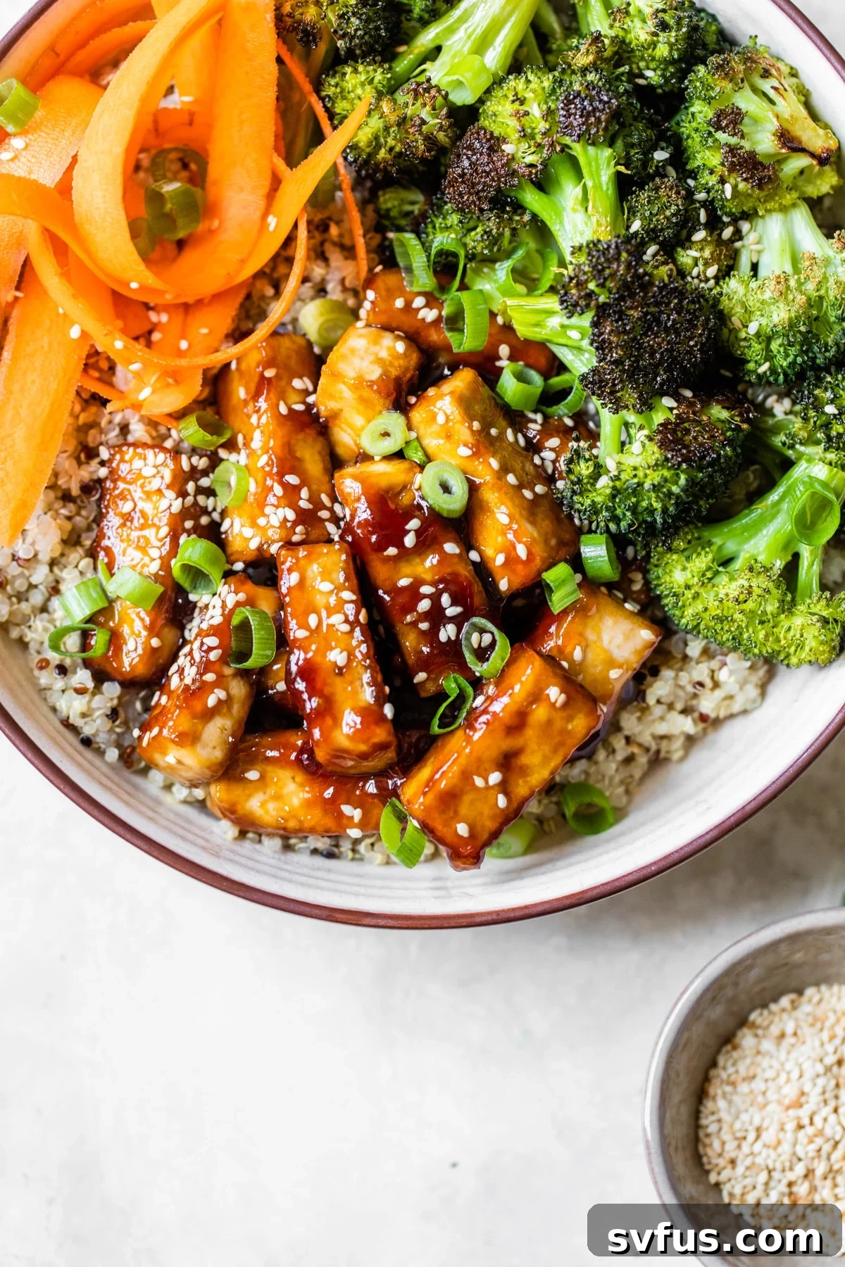 A plate of food with broccoli, with Tofu and Bowl