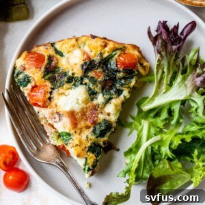 a slice of egg white frittata on a plate with a fork