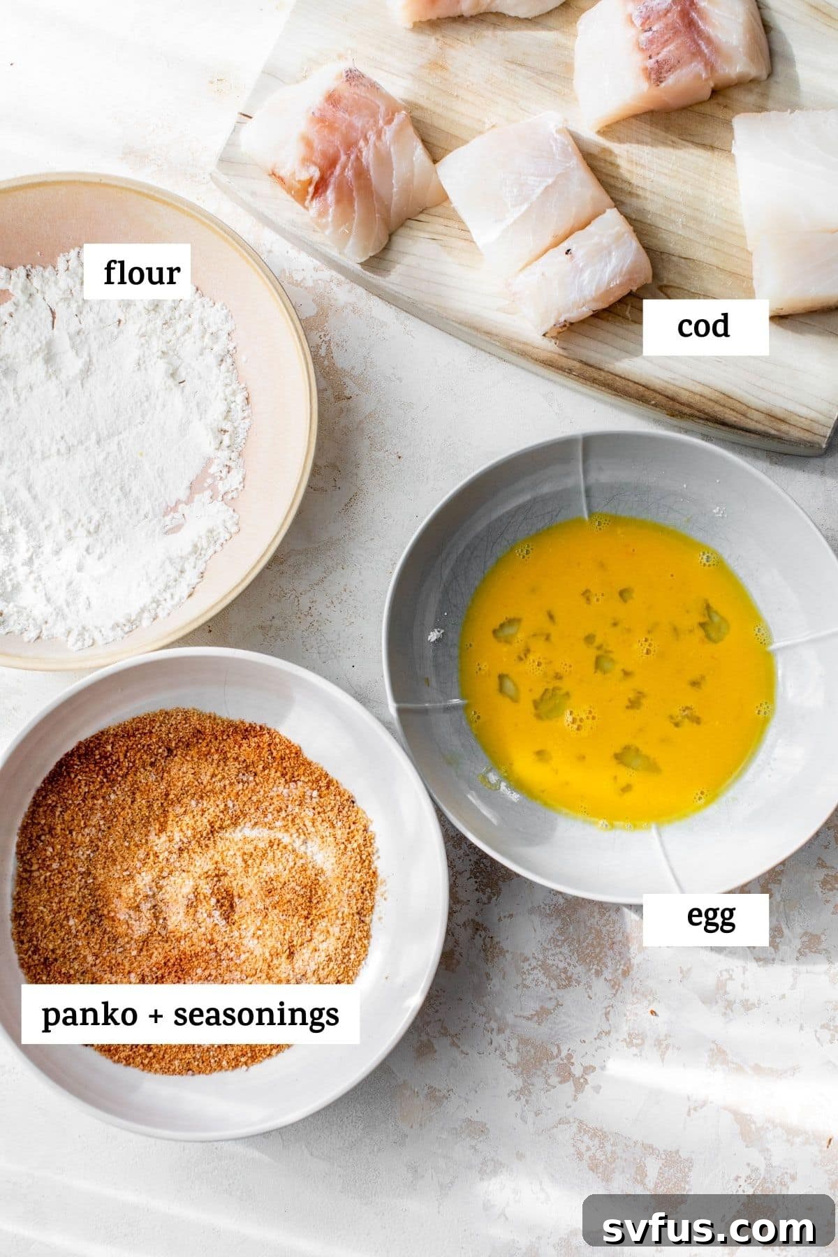 ingredients to make a cod sandwich, like cod fillets, breadcrumbs, and spices