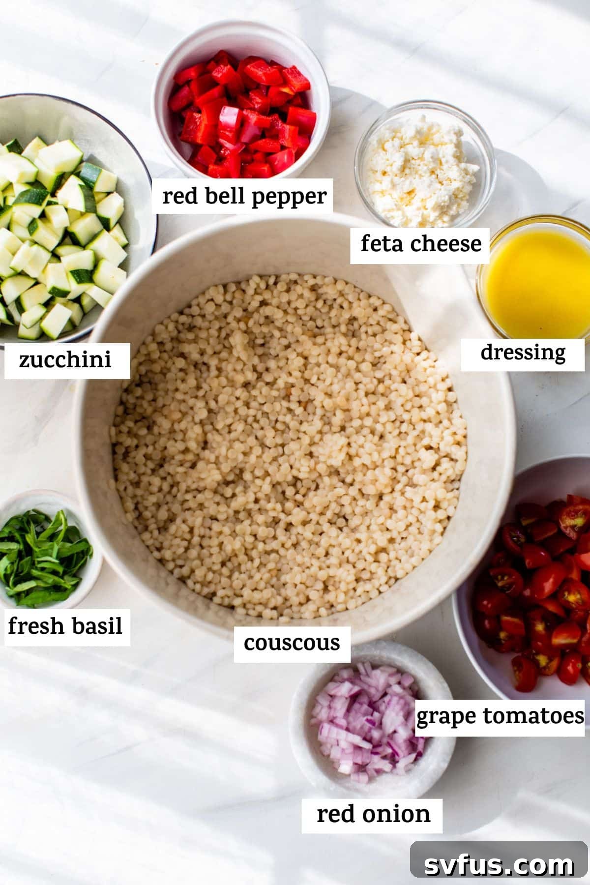 A visual display of all the fresh ingredients for vegetable couscous, neatly arranged in bowls with labels.
