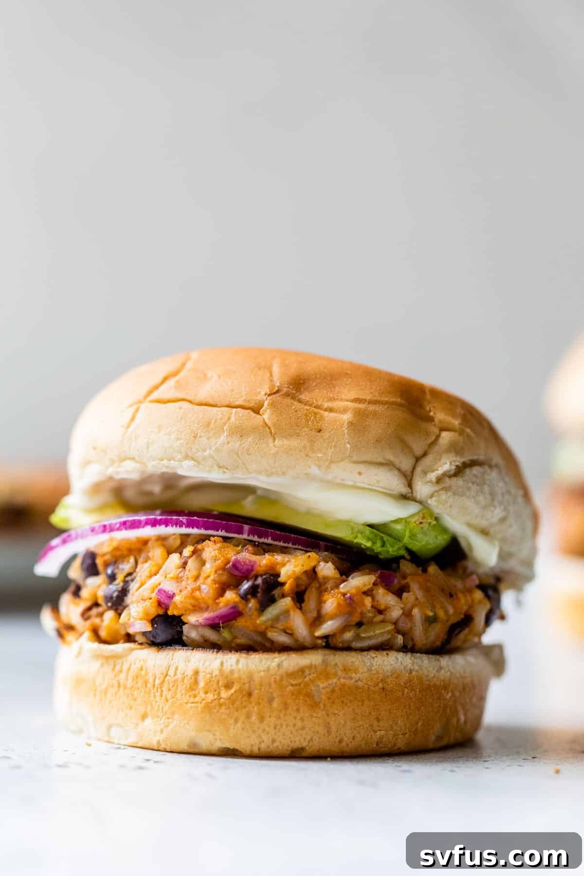 close-up of a sweet potato black bean burger, perfectly cooked and ready to serve.
