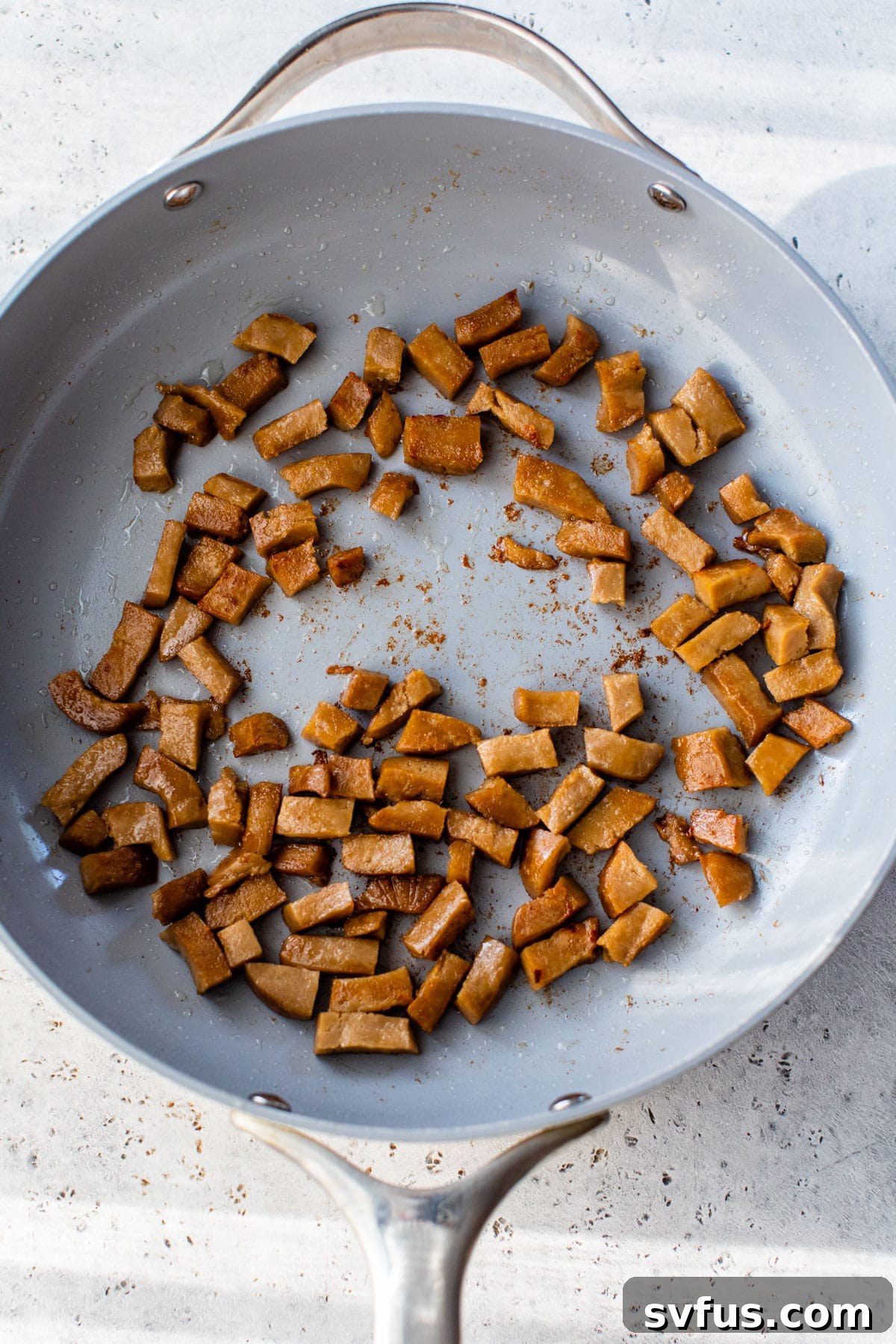seitan cooking in a large skillet