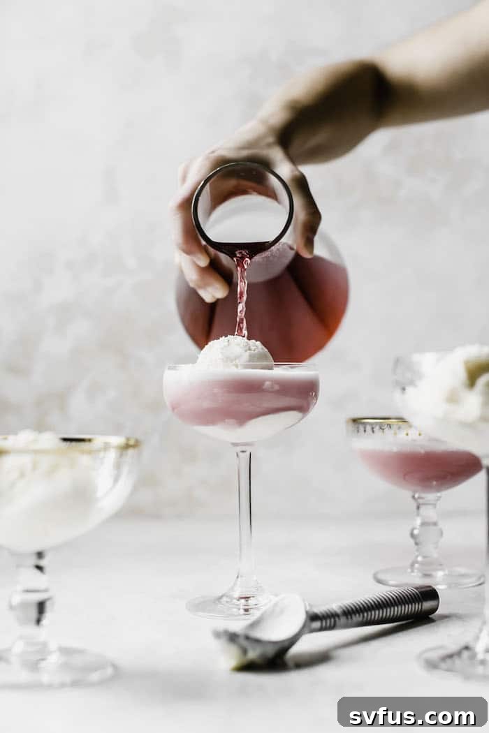 Delicious Hibiscus Ice Cream Float being prepared, showcasing the beautiful red tea.