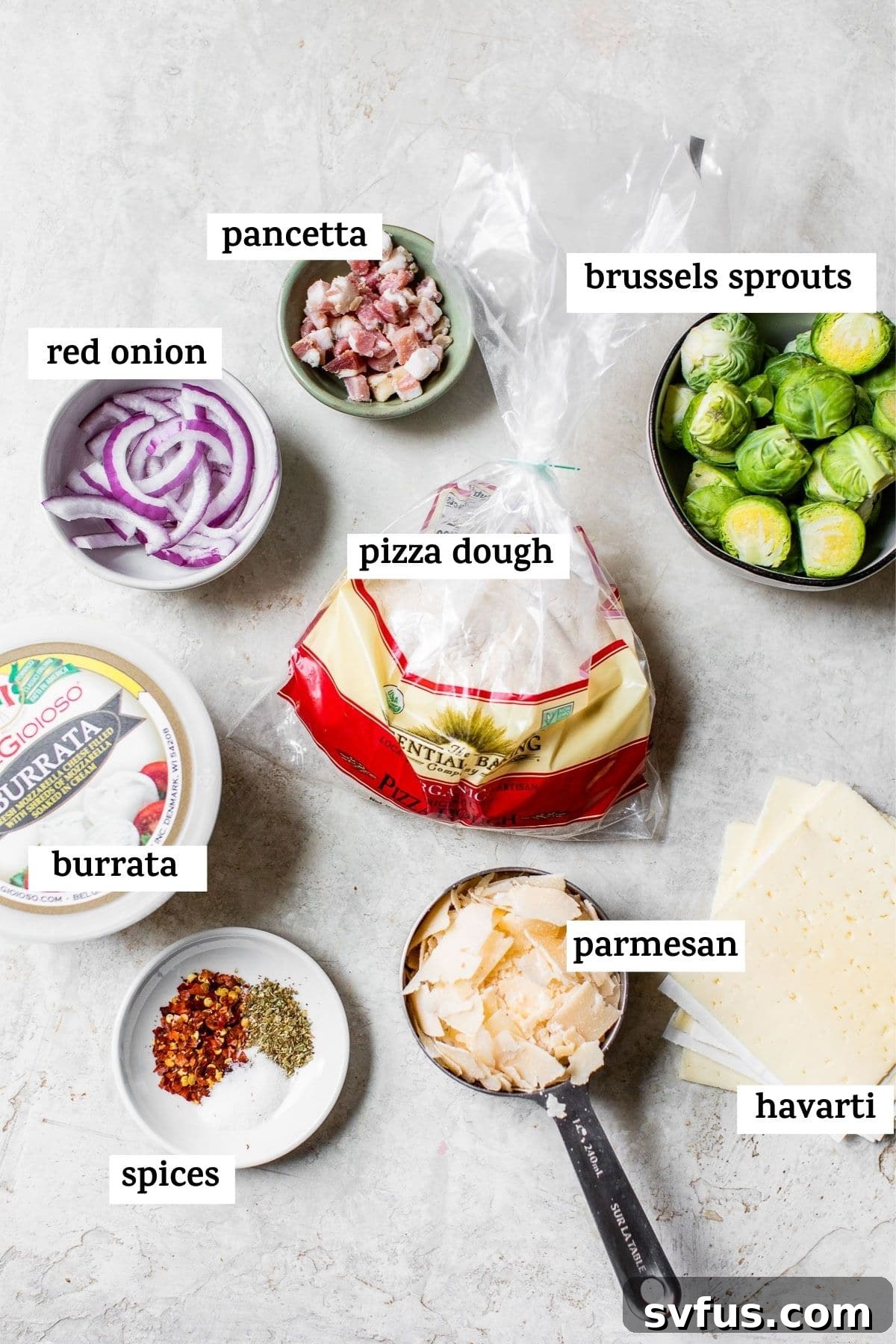 Fresh ingredients for Brussels Sprouts Pizza including brussels sprouts, red onion, pancetta, and burrata cheese.