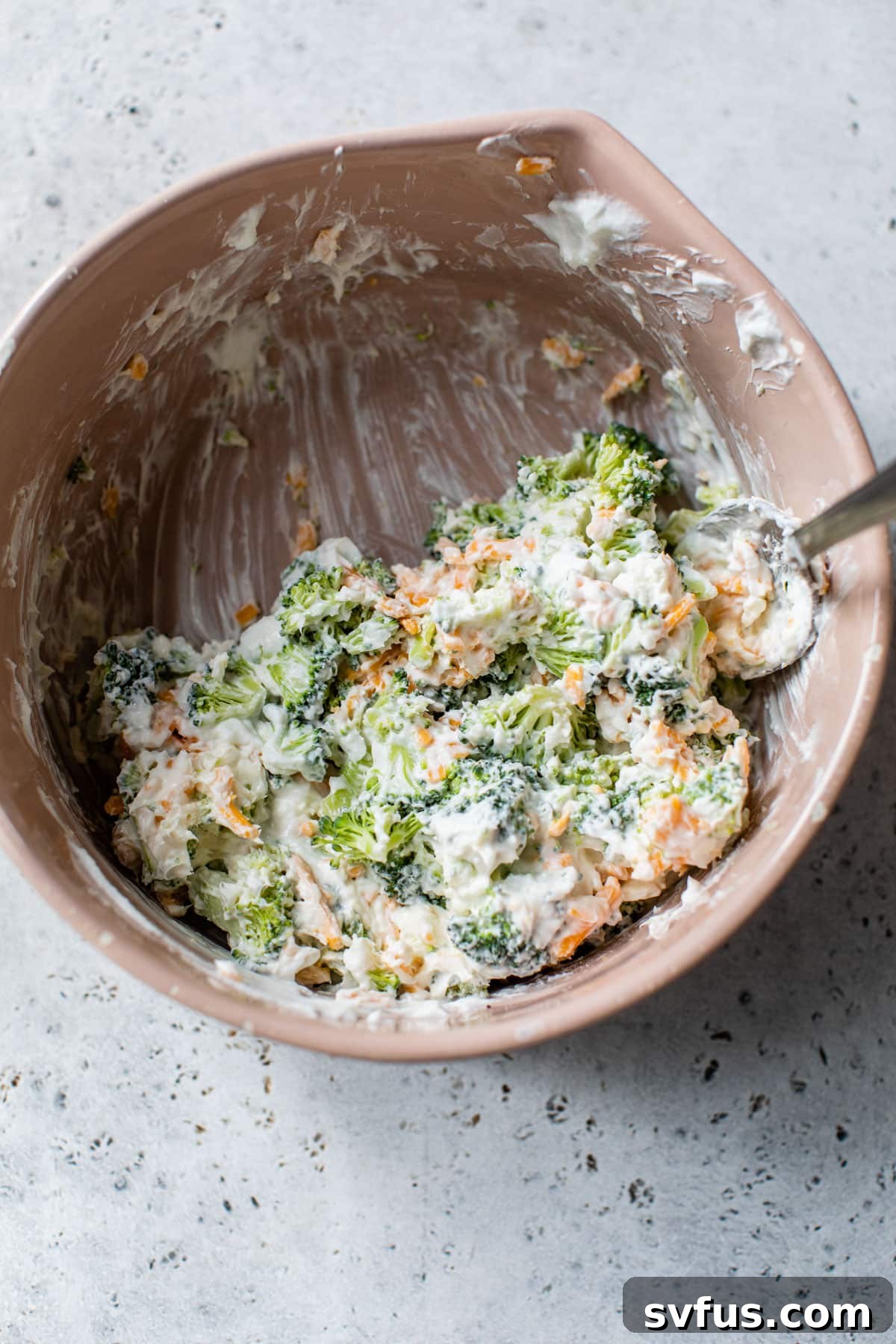 All ingredients for the stuffed chicken breast filling are mixed in a bowl.