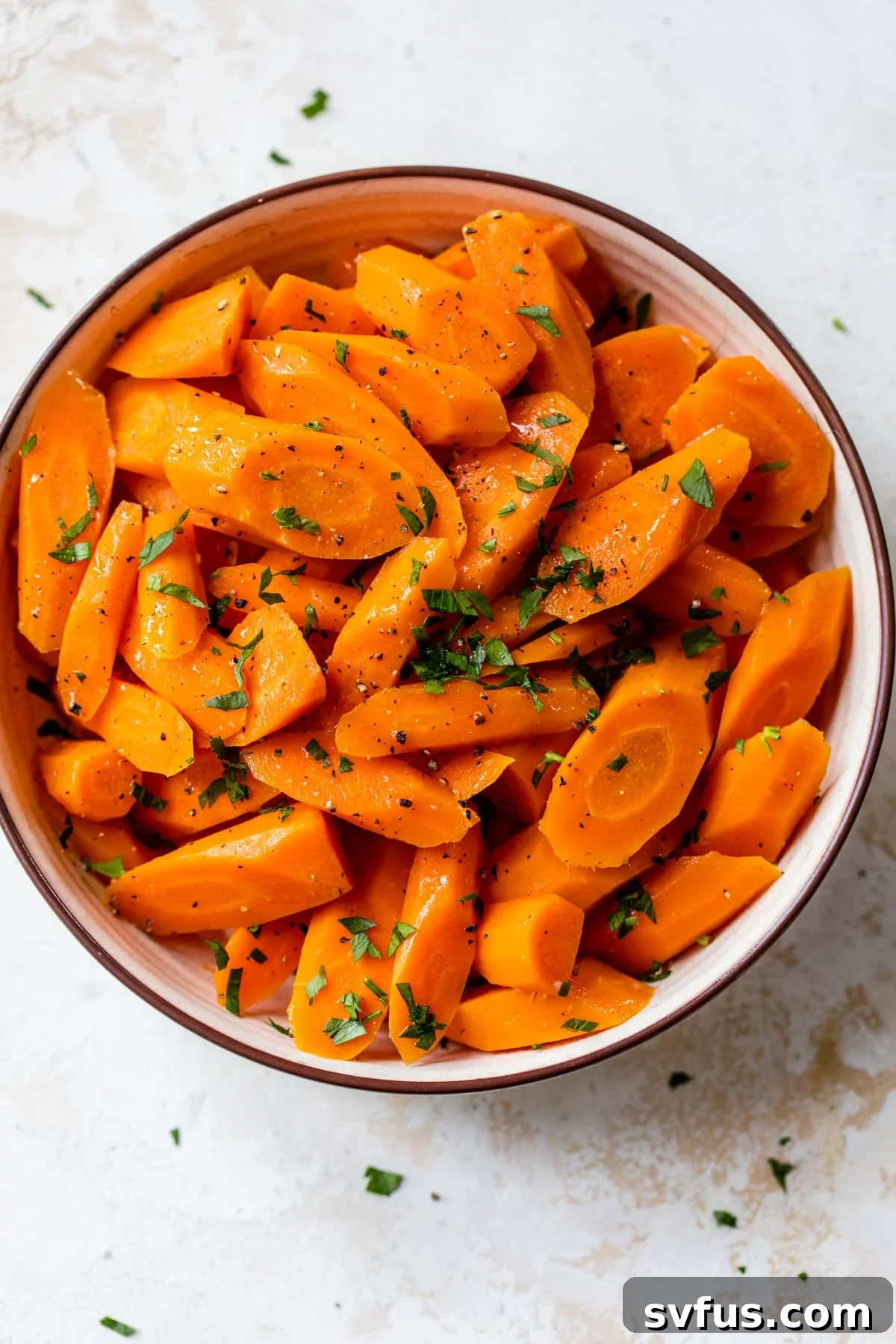 instant pot carrots inside a bowl with fresh parsley on top