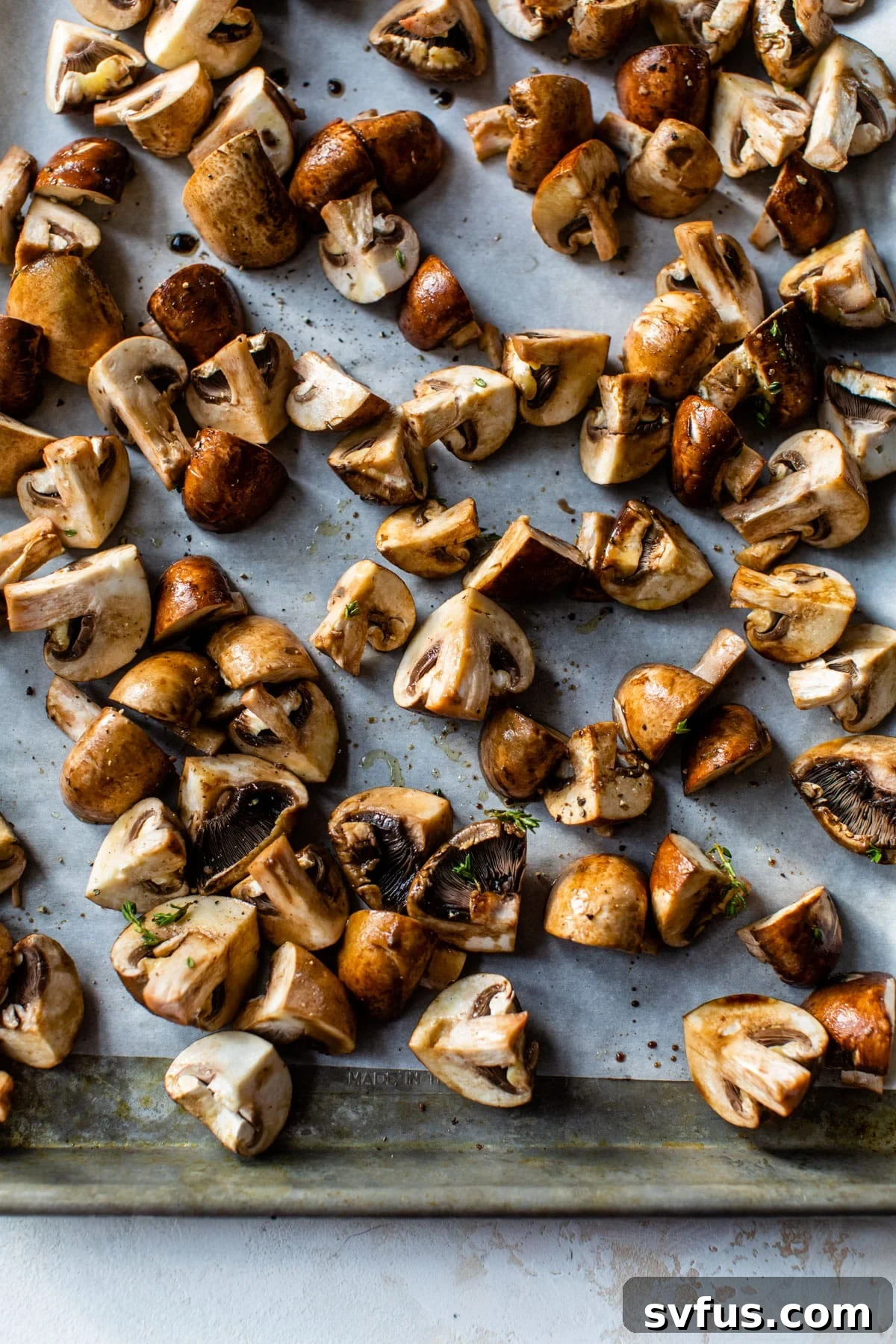 chopped mushrooms on a parchment lined baking sheet