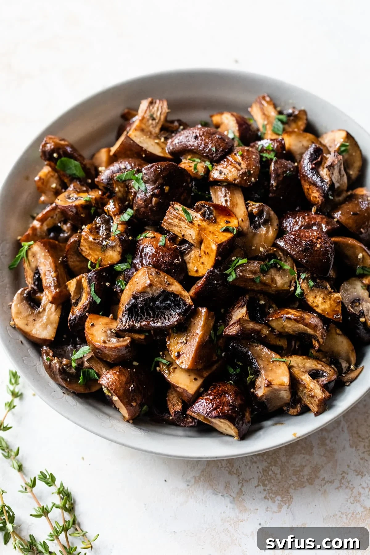 roasted mushrooms in a bowl with parsley