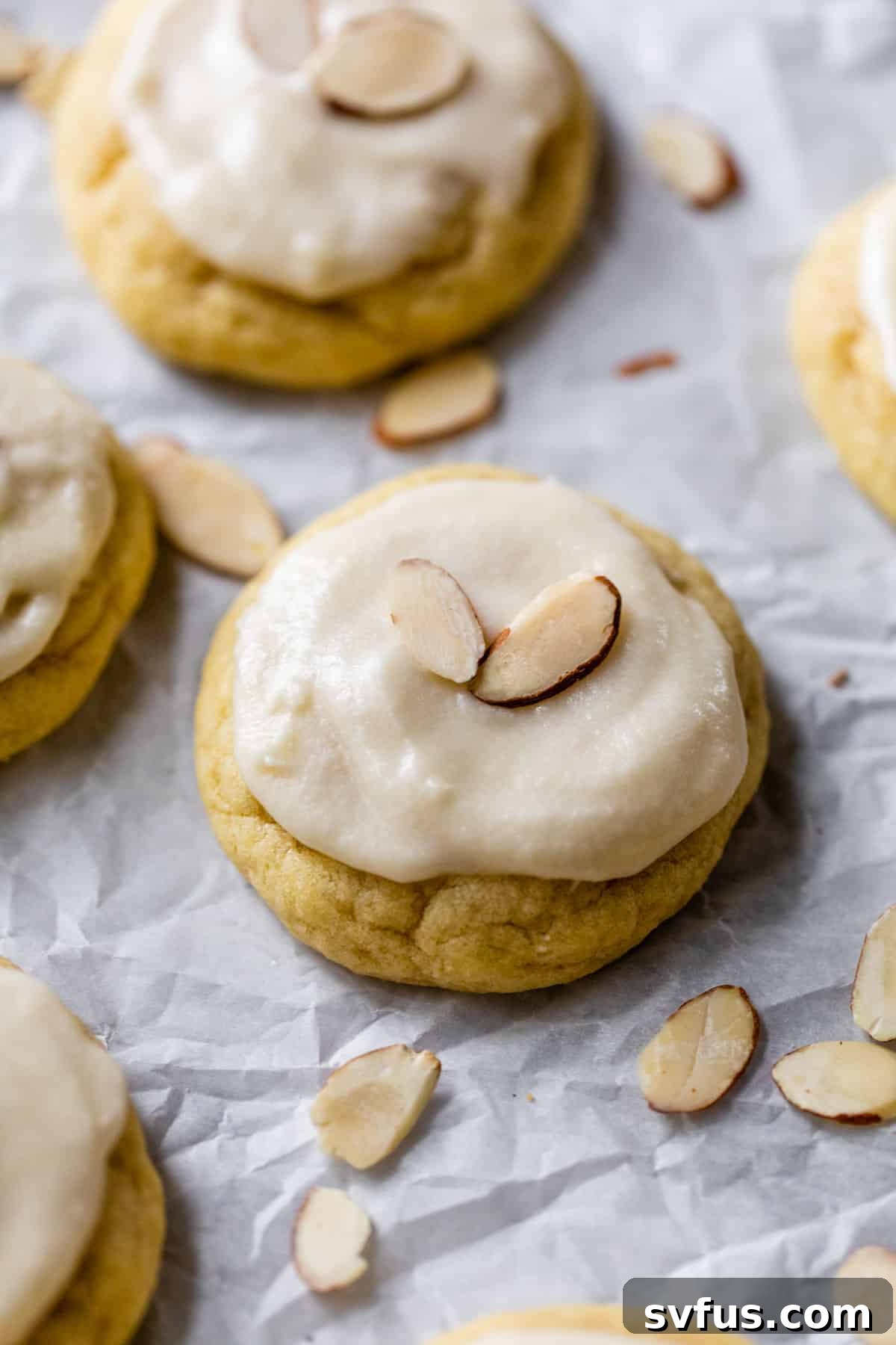 Close-up of an iced almond sugar cookie, perfectly presented and ready to be enjoyed.