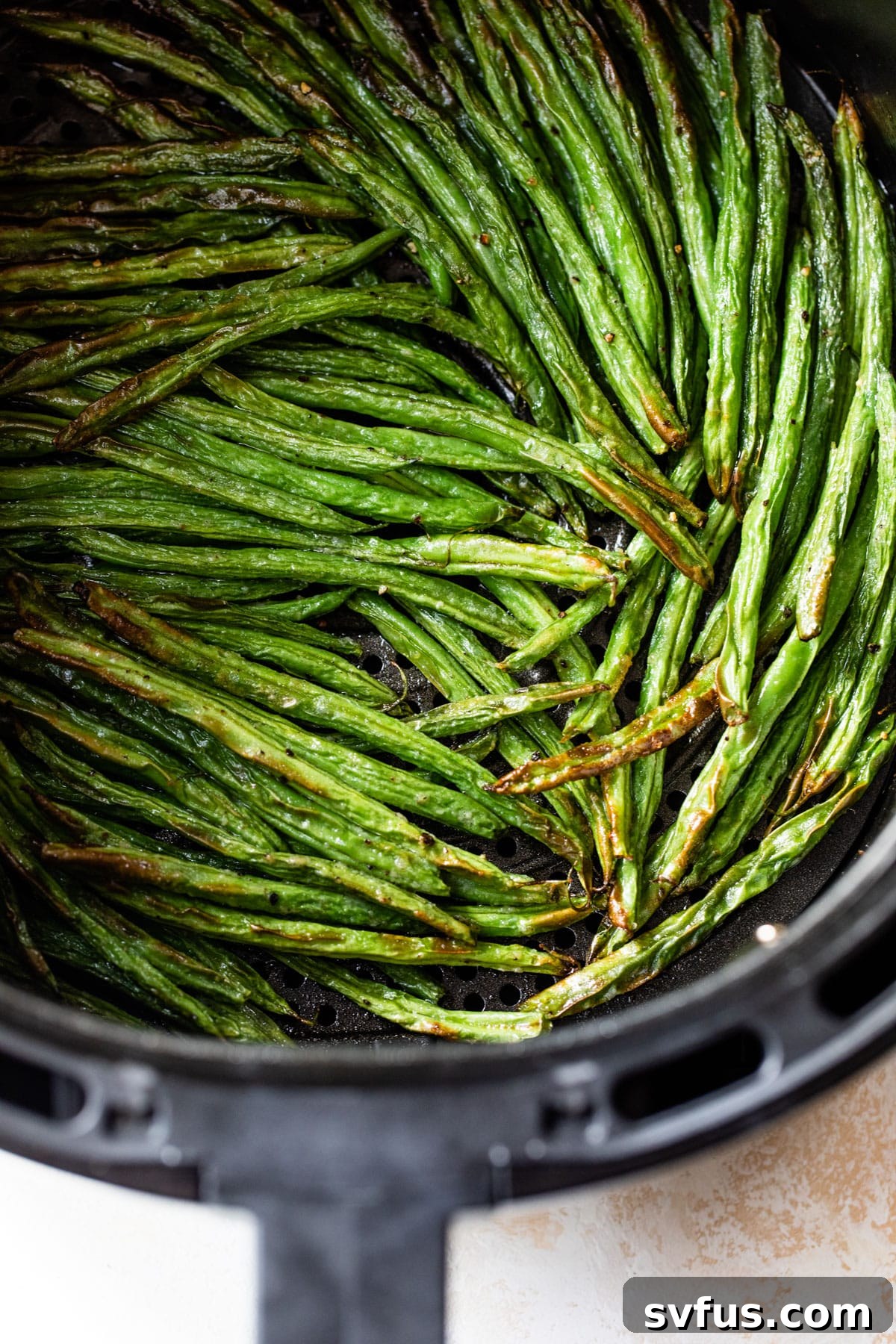 roasted green beans in an air fryer