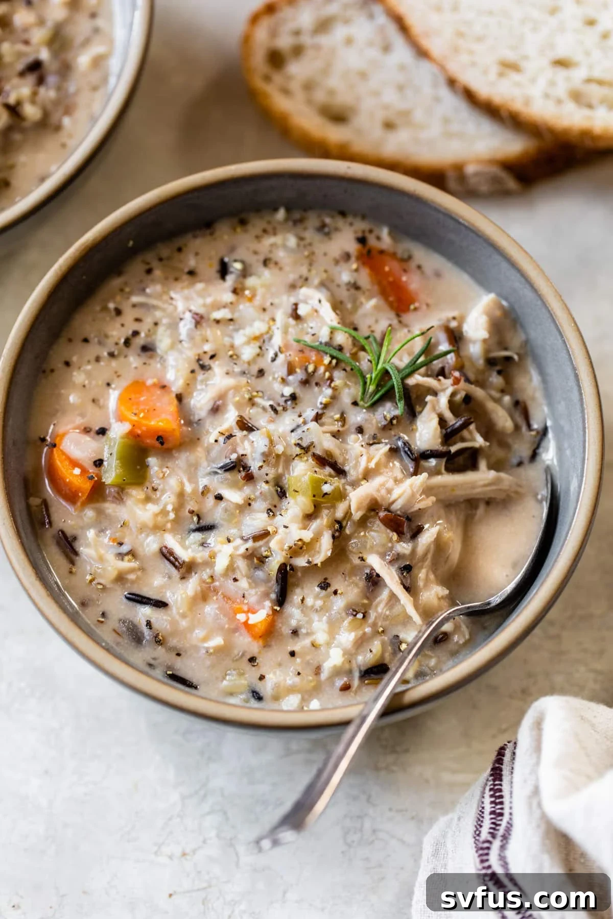 chicken wild rice soup in a bowl with a spoon