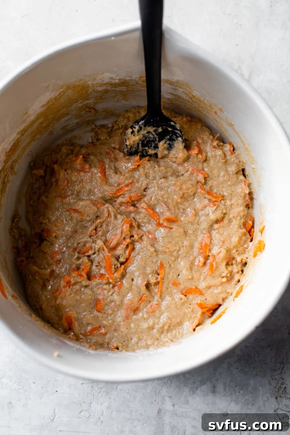 pancake batter in a large bowl with a spatula