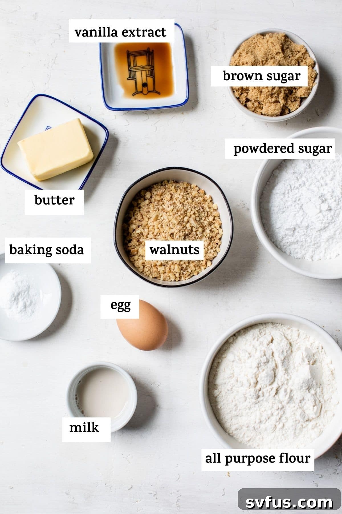 An overhead shot showcasing all the essential ingredients laid out for making thumbprint cookies, with a text overlay