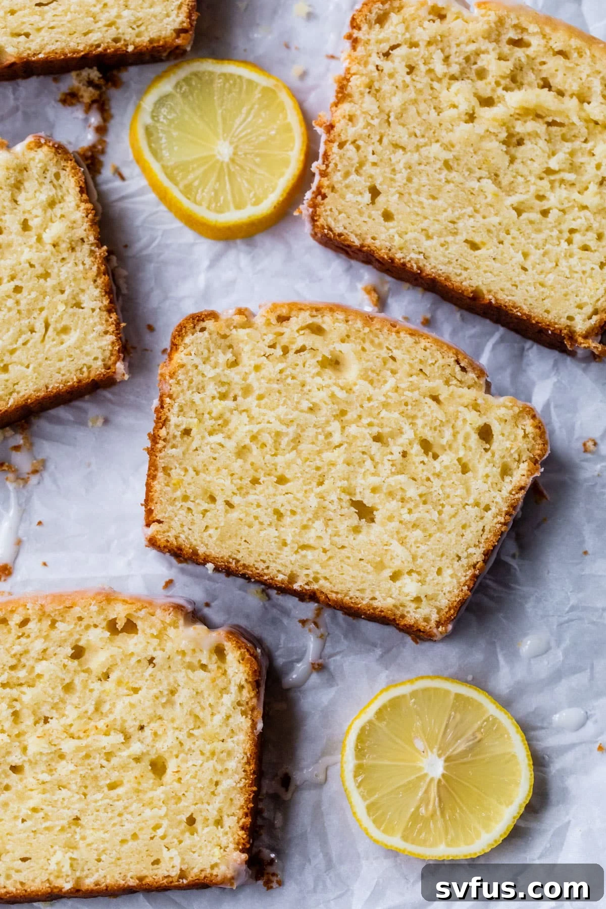 overview of slices of lemon loaf on parchment paper
