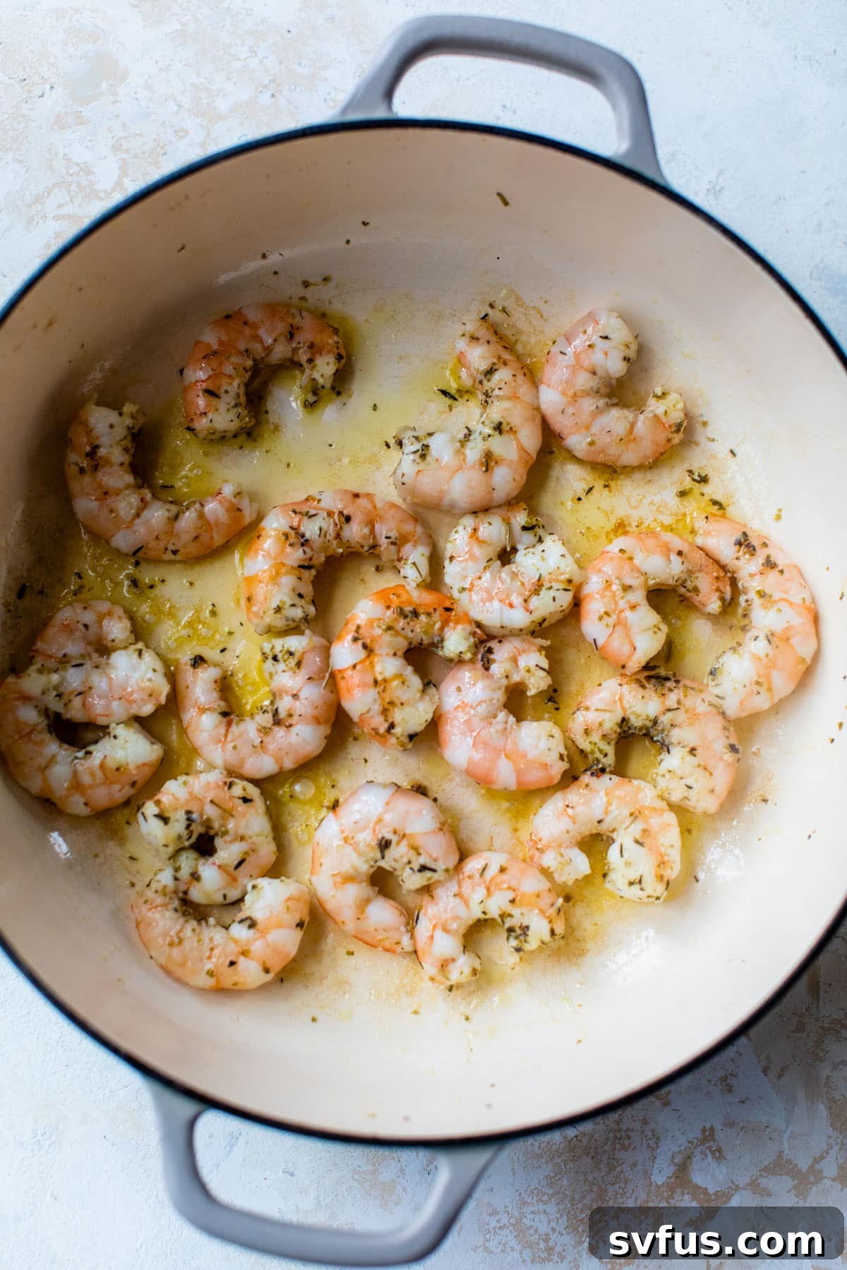 shrimp cooking in a dutch oven