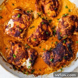 Overview of paprika chicken in a large skillet, presented beautifully.