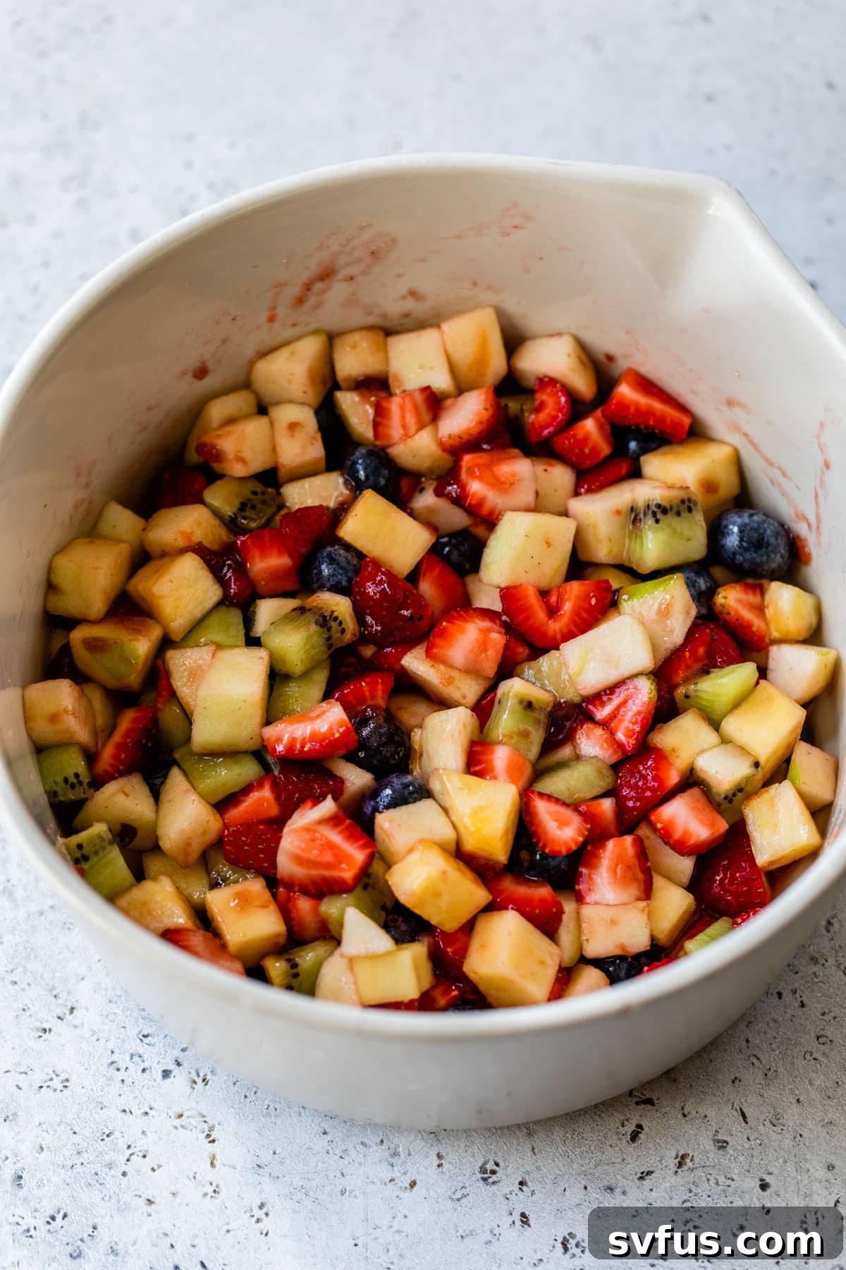 all fruit salsa ingredients combined in a large bowl