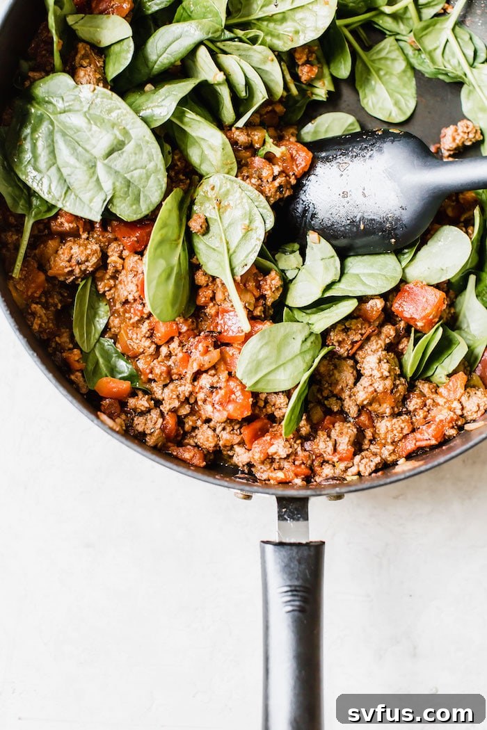 Close-up of Beef Ragu simmering with fresh ingredients