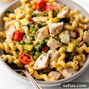 Chicken Pasta Primavera in a bowl, ready to eat.