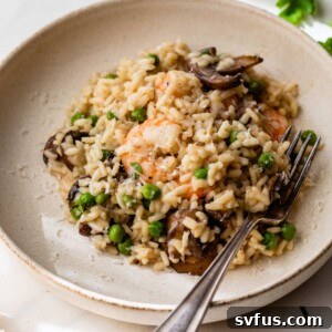 Shrimp risotto in a bowl with a fork